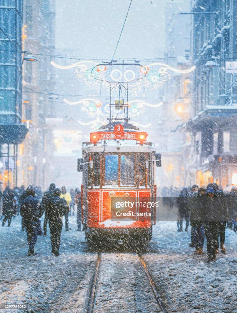 Winter and Red Tram in Istiklal Street, Beyoglu, Istanbul.