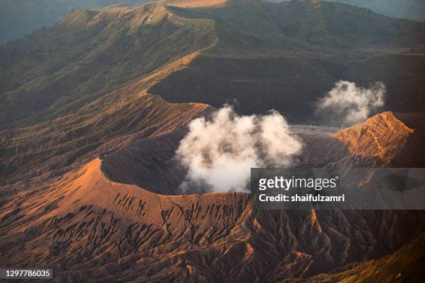 close view of bromo's active crater. mount bromo (2,329 meters) is an active volcano and part of the tengger massif, in east java, indonesia. - bromo crater fotografías e imágenes de stock