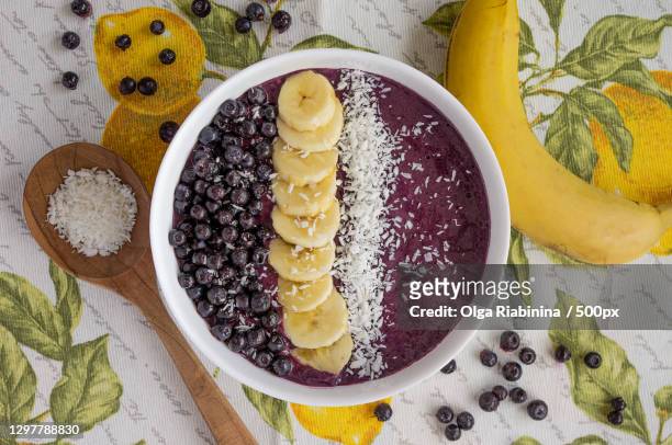 high angle view of healthy food in bowl on table - smoothie bowl fotografías e imágenes de stock