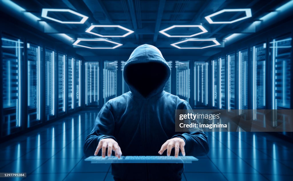 Computer Hacker In Server Room High-Res Stock Photo - Getty Images