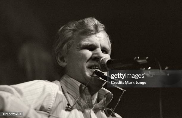 North Carolinian guitarist and folksinger Doc Watson plays his guitar and harmonica at the Sundance Saloon on October 13, 1985 in Fort Collins,...