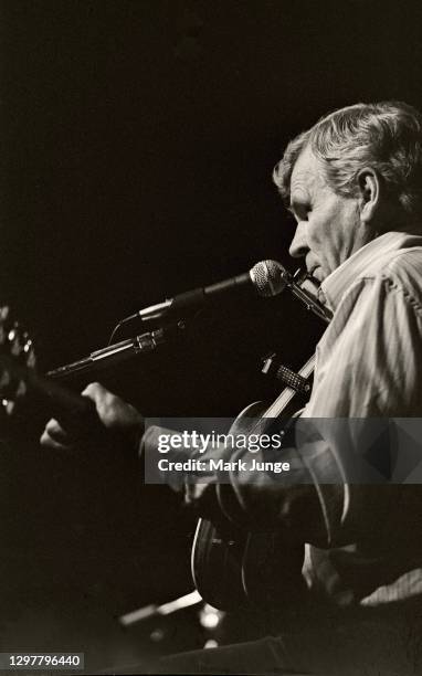 North Carolinian guitarist and folksinger Doc Watson plays his guitar and harmonica at the Sundance Saloon on October 13, 1985 in Fort Collins,...