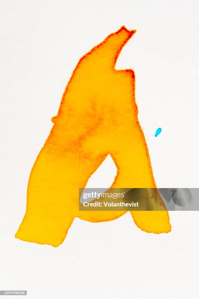Vibrant orange A letter, watercolor painted on paper