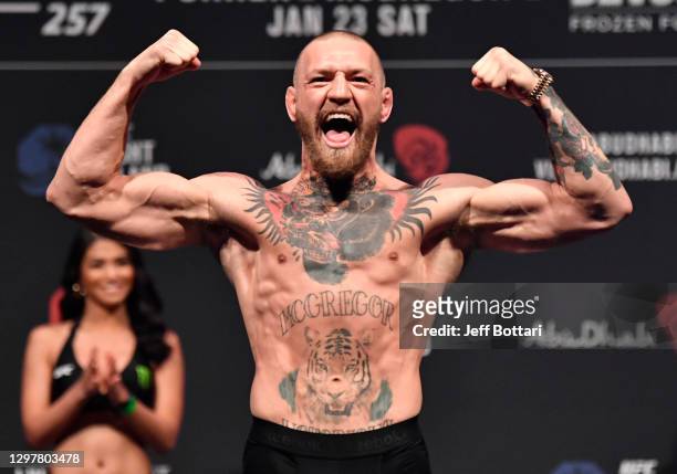 Conor McGregor of Ireland poses on the scale during the UFC 257 weigh-in at Etihad Arena on UFC Fight Island on January 22, 2021 in Abu Dhabi, United...