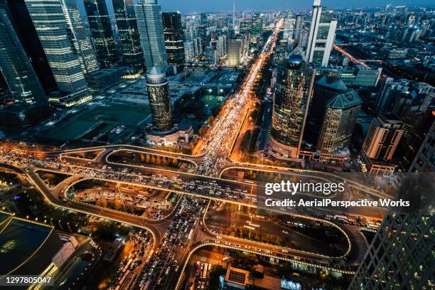 aerial view of beijing traffic and road intersection at rush hour - beijing road stock pictures, royalty-free photos & images