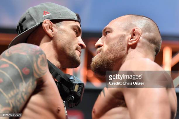 Opponents Dustin Poirier and Conor McGregor of Ireland face off during the UFC 257 weigh-in at Etihad Arena on UFC Fight Island on January 22, 2021...