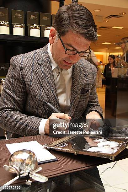 Artisan Designer Michael Aram signs his work at Ready, Set, Pink! event at Bloomingdale's at Roosevelt Field Mall on October 20, 2011 in Garden City,...