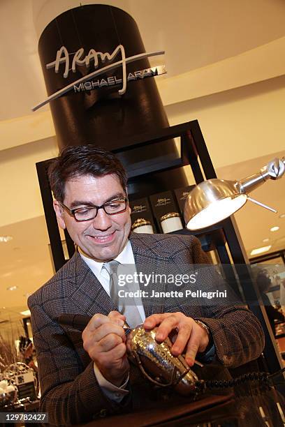 Artisan Designer Michael Aram signs his work at Ready, Set, Pink! event at Bloomingdale's at Roosevelt Field Mall on October 20, 2011 in Garden City,...