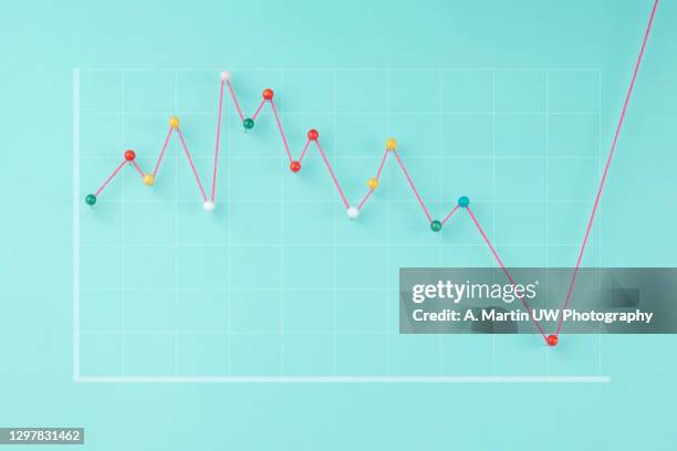 statistical financial graph predicting economic growth on a blue background. - certificado de una acción fotografías e imágenes de stock