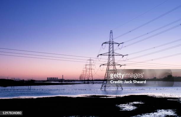 flooded electricity pylons - electricity pylons stock pictures, royalty-free photos & images