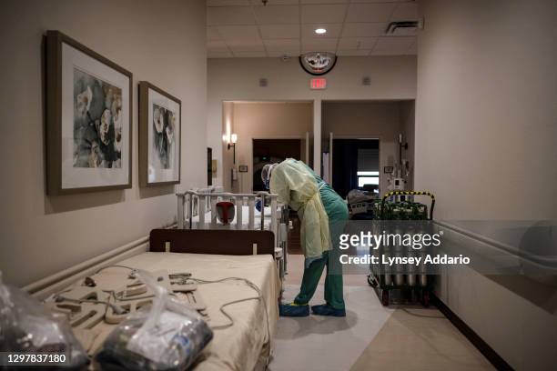 Leviticus Lister an emergency room technician from Louisiana, rests for a moment in a passageway of the Intensive Care Unit of the Serious Infectious...