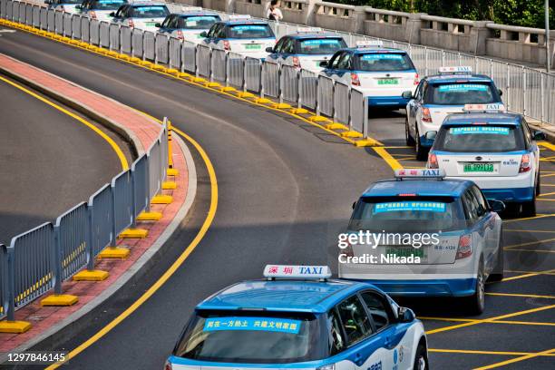 elektrische byd taxi's in shenzhen, china - chinese car home stockfoto's en -beelden