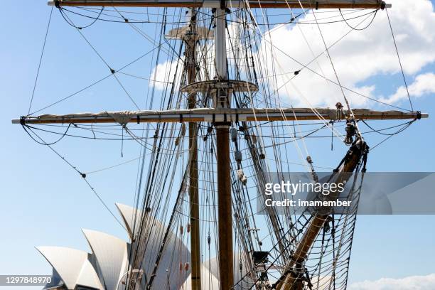 sydney opera house roofline the sails behid tall ship, sky background with copy space - tall ship stock pictures, royalty-free photos & images