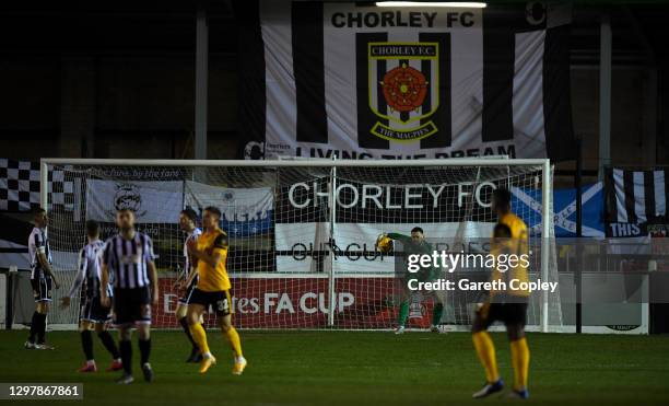 Matt Urwin of Chorley FC gets the ball back after conceding their first goal which was scored by Vitinha of Wolverhampton Wanderers during The...