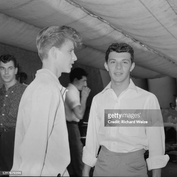 Teen idols Bobby Rydell and Frankie Avalon talk backstage during rehearsal for "Dick Clark's Caravan of Stars" at the Hollywood Bowl, August 30, 1959...