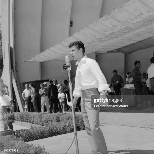 Teen idol Frankie Avalon rehearses for "Dick Clark's Caravan of Stars" on stage at the Hollywood Bowl, August 30, 1959 in Hollywood, CA.