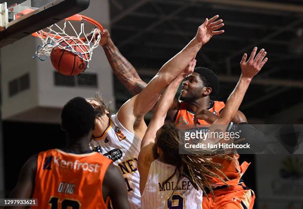 Cameron Oliver of the Taipans slam dunks the ball during the round two NBL match between the Cairns Taipans and the Sydney Kings at Cairns Pop Up...