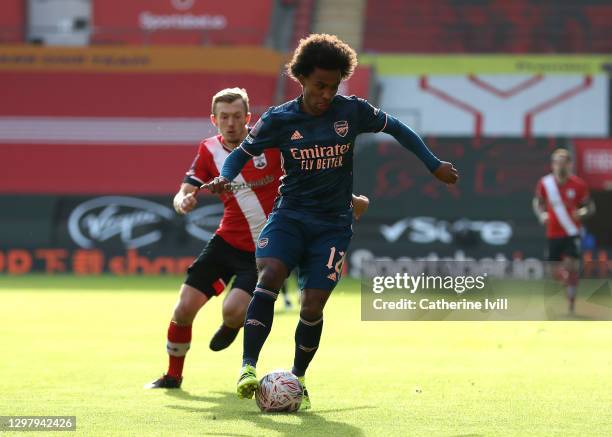 Willian of Arsenal is challenged by James Ward-Prowse of Southampton during The Emirates FA Cup Fourth Round match between Southampton FC and Arsenal...