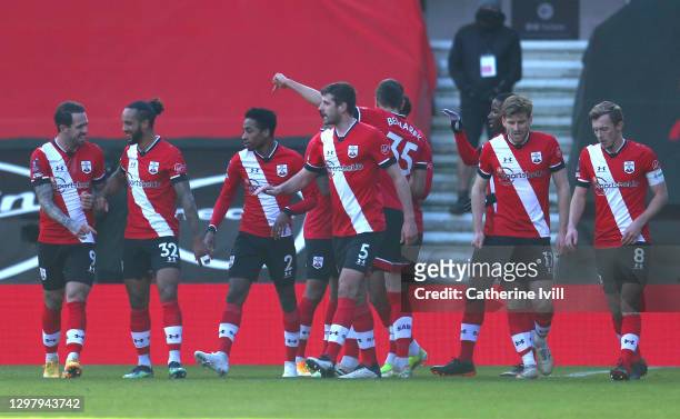 Danny Ings, Theo Walcott, Kyle Walker-Peters, Jack Stephens, Stuart Armstrong and James Ward-Prowse of Southampton celebrate their sides first goal,...