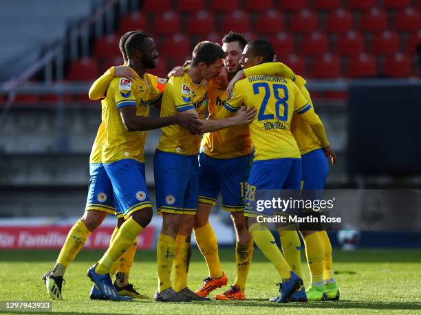 Marcel Bar of Eintracht Braunschweig celebrates with team mates after scoring their side's second goal during the Second Bundesliga match between...