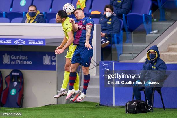 Pablo Maffeo of SD Huesca competes for the ball with Alfonso Pedraza of Villarreal CF during the La Liga Santander match between SD Huesca and...