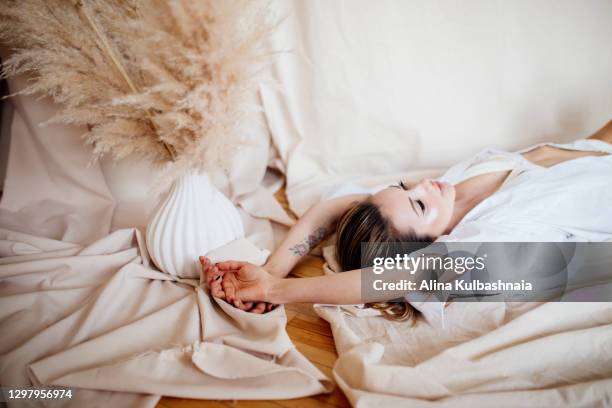 beautiful woman lying on the floor - simferopol stock pictures, royalty-free photos & images