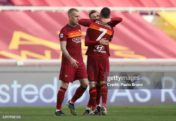 Borja Mayoral of A.S Roma celebrates with teammates Rick Karsdorp and Lorenzo Pellegrini after scoring his team's first goal during the Serie A match...