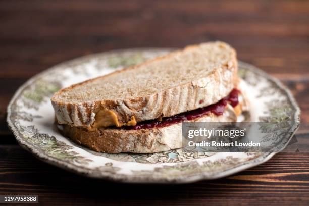 close up of a peanut butter and jelly sandwich - peanut butter and jelly sandwich stock pictures, royalty-free photos & images