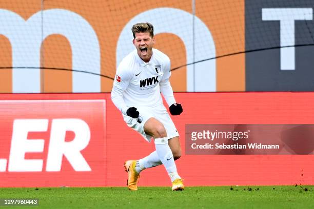 Florian Niederlechner of Augsburg celebrates after scoring their team's first goal during the Bundesliga match between FC Augsburg and 1. FC Union...