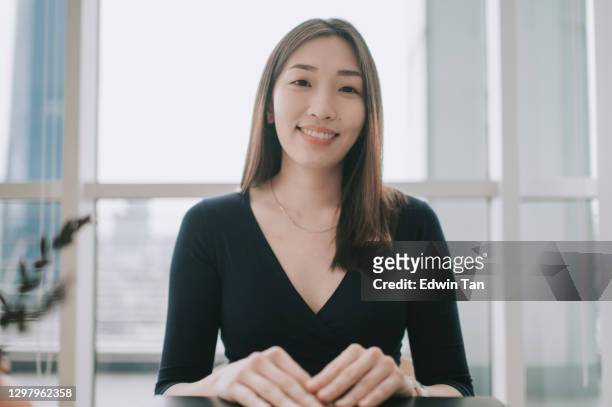 asian chinese beautiful woman looking at camera videocall smiling indoor - corporate virtual event stock pictures, royalty-free photos & images