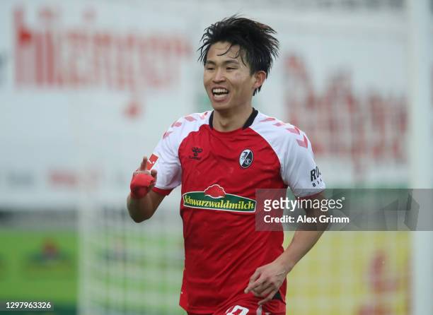 Wooyeong Jeong of Sport-Club Freiburg celebrates after scoring their side's second goal during the Bundesliga match between Sport-Club Freiburg and...