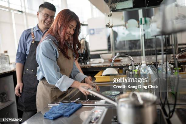 smiling asian chinese business owners with apron ready reopen business. - sud side company stock pictures, royalty-free photos & images
