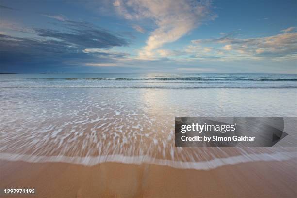 seascape photograph with water motion - northumberland stock pictures, royalty-free photos & images