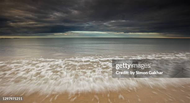 seascape photograph with water motion - northumberland stock pictures, royalty-free photos & images