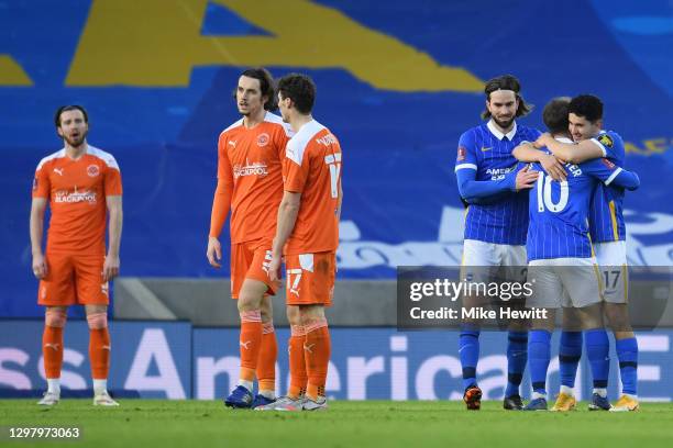 Steven Alzate of Brighton and Hove Albion celebrates with teammates Davy Propper and Alexis Mac Allister of Brighton and Hove Albion after scoring...