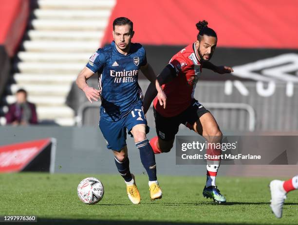 Cedric of Arsenal breaks past Theo Walcott of Southampton during on January 23, 2021 in Southampton, England. Sporting stadiums around the UK remain...