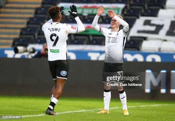 Ollie Cooper of Swansea City celebrates with team mate Jamal Lowe of Swansea City after scoring their side's fifth goal during The Emirates FA Cup...