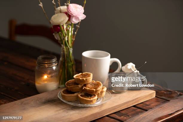 butter pumpkin tarts on a serving board - nut butter stock pictures, royalty-free photos & images