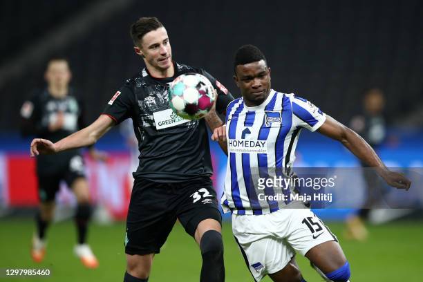 Jhon Cordoba of Hertha Berlin and Marco Friedl of SV Werder Bremen battle for possession during the Bundesliga match between Hertha BSC and SV Werder...