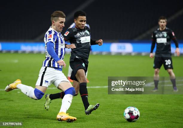 Peter Pekarik of Hertha Berlin and Felix Agu of SV Werder Bremen battle for possession during the Bundesliga match between Hertha BSC and SV Werder...