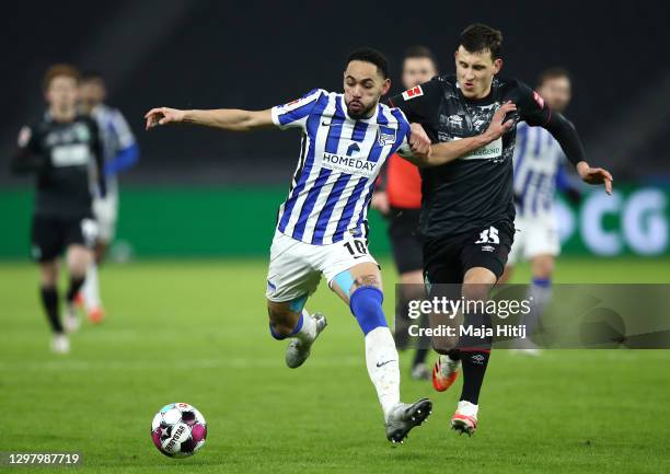 Matheus Cunha of Hertha Berlin and Maximilian Eggestein of SV Werder Bremen battle for possession during the Bundesliga match between Hertha BSC and...