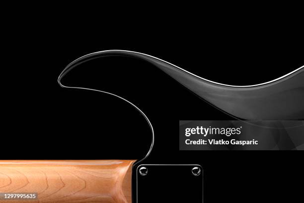 back of an electric guitar on black background - electric guitar stock-fotos und bilder