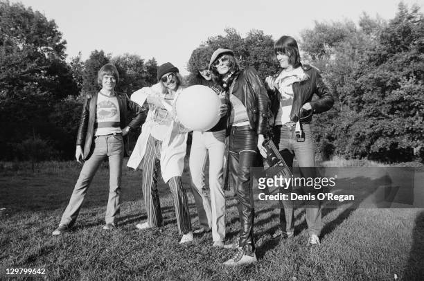 British rock group Hawkwind outside Rockfield Studios, Wales, circa 1979. Left to right: guitarist Huw Lloyd-Langton, guitarist and singer Dave...
