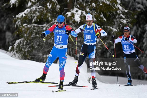 Alexander Loginov of Russian Federation and Tomas Krupcik of Czech Republic competes during the Men 20 km Individual Competition at the BMW IBU World...
