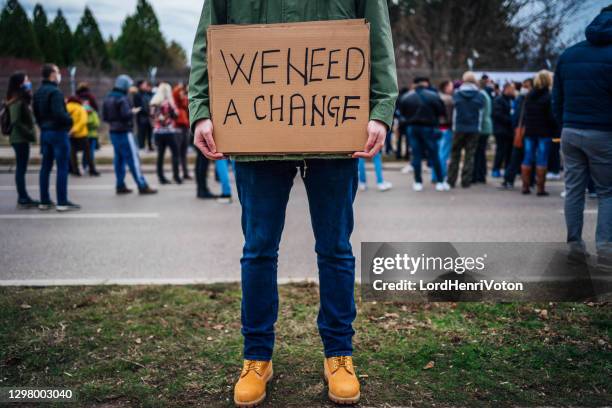 man protesting at the street - weakness stock pictures, royalty-free photos & images