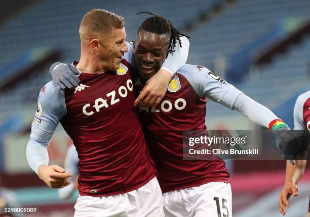 Bertrand Traore of Aston Villa celebrates with teammate Ross Barkley after scoring their team's second goal during the Premier League match between...