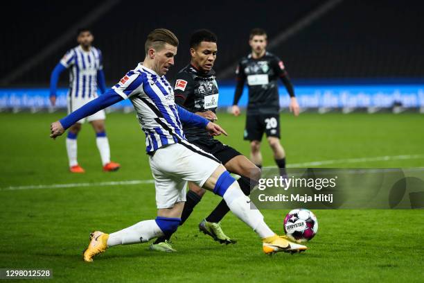 Peter Pekarik of Hertha Berlin and Felix Agu of SV Werder Bremen battle for possession during the Bundesliga match between Hertha BSC and SV Werder...