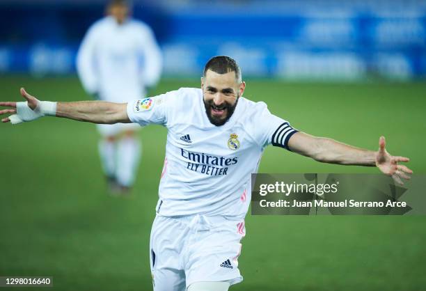 Karim Benzema of Real Madrid celebrates after scoring his team's second goal during the La Liga Santander match between Deportivo Alavés and Real...