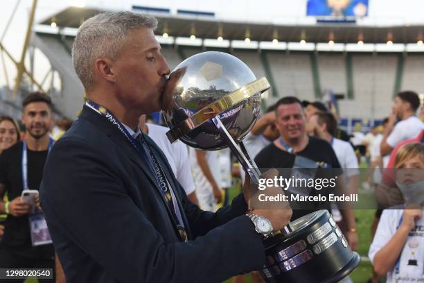 Hernan Crespo coach of Defensa y Justicia kisses the champions trophy after the final of Copa CONMEBOL Sudamericana 2020 between Lanús and Defensa y...