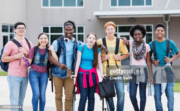 multi-ethnic high school students standing together - teenagers only stock pictures, royalty-free photos & images